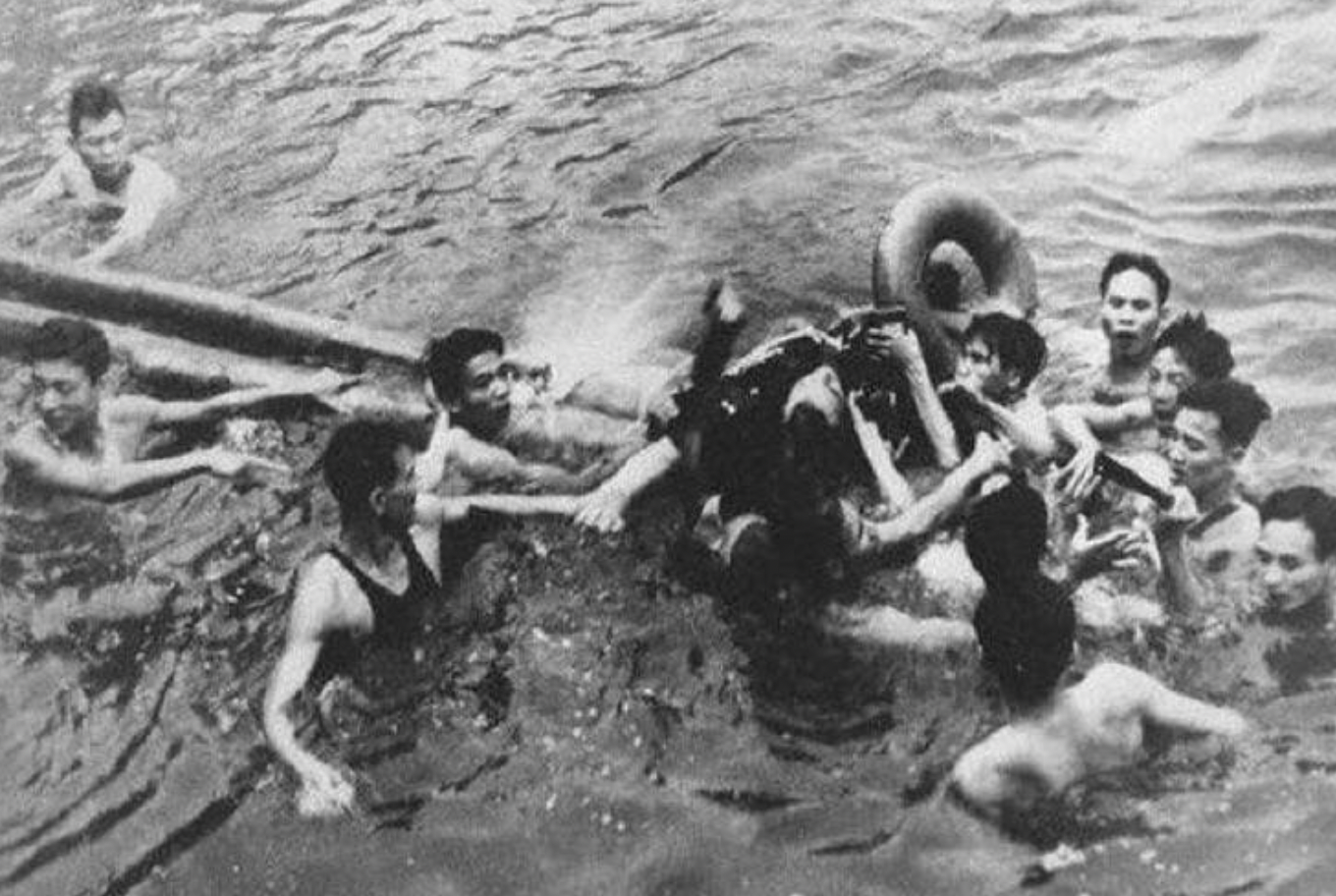 North Vietnamese pull U.S airman John McCain out of a lake in 1967. He had ejected from his plane after it had been shot down, and he broke his right leg and both arms while being knocked unconscious from the force. He was held captive by the Viet Cong for over five years.