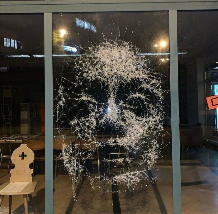 Artist Simon Berger creates his work by cracking glass with a hammer very meticulously to avoid shattering the whole piece of glass.