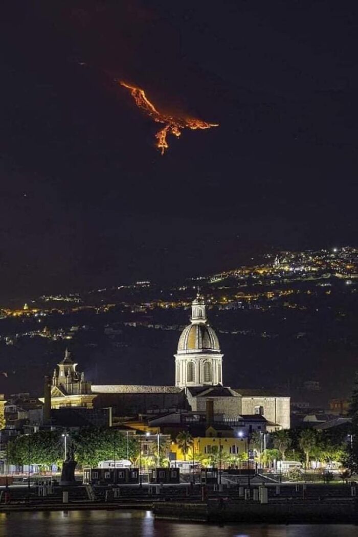 A fiery Phoenix appears in the sky caused by the Eruption on Mount Etna in Sicily.