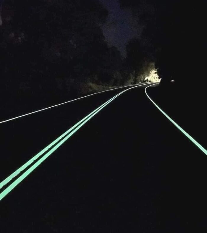 Some roads in Australia use glow in the dark / fluorescent paint for better night visibilty.