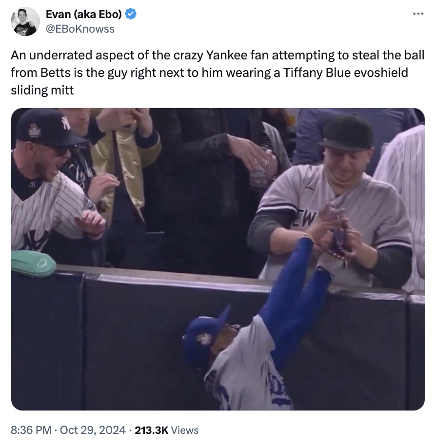 photo caption - Evan aka Ebo ... An underrated aspect of the crazy Yankee fan attempting to steal the ball from Betts is the guy right next to him wearing a Tiffany Blue evoshield sliding mitt Views