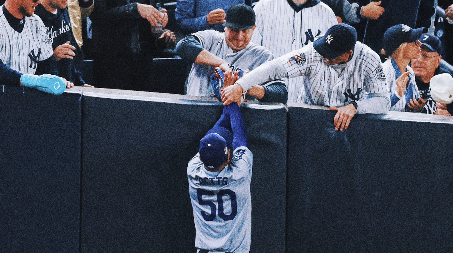 A Yankees fan rips the ball out of Mookie Betts’s glove during Game 4 of the World Series. 