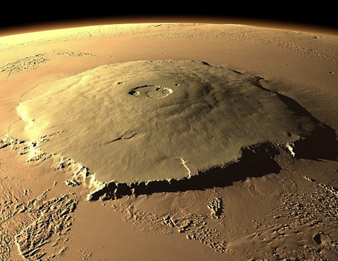 The tallest mountain in the solar system, Olympus Mons on Mars. It has a height of 25 km, Mount Everest is 'only' 8.8 km tall.