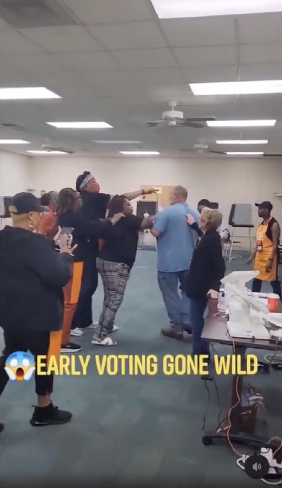 Poll workers and man get physical, after man refuses to take off his political hat. 