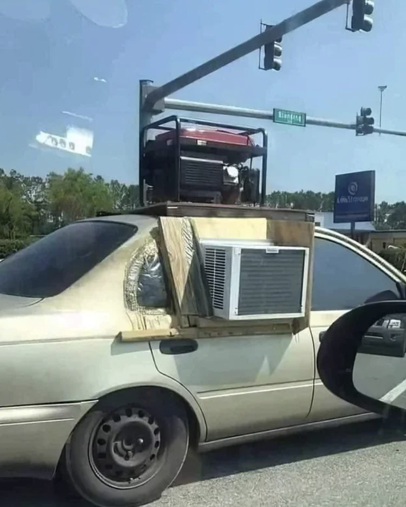 car with air conditioner in window - 359