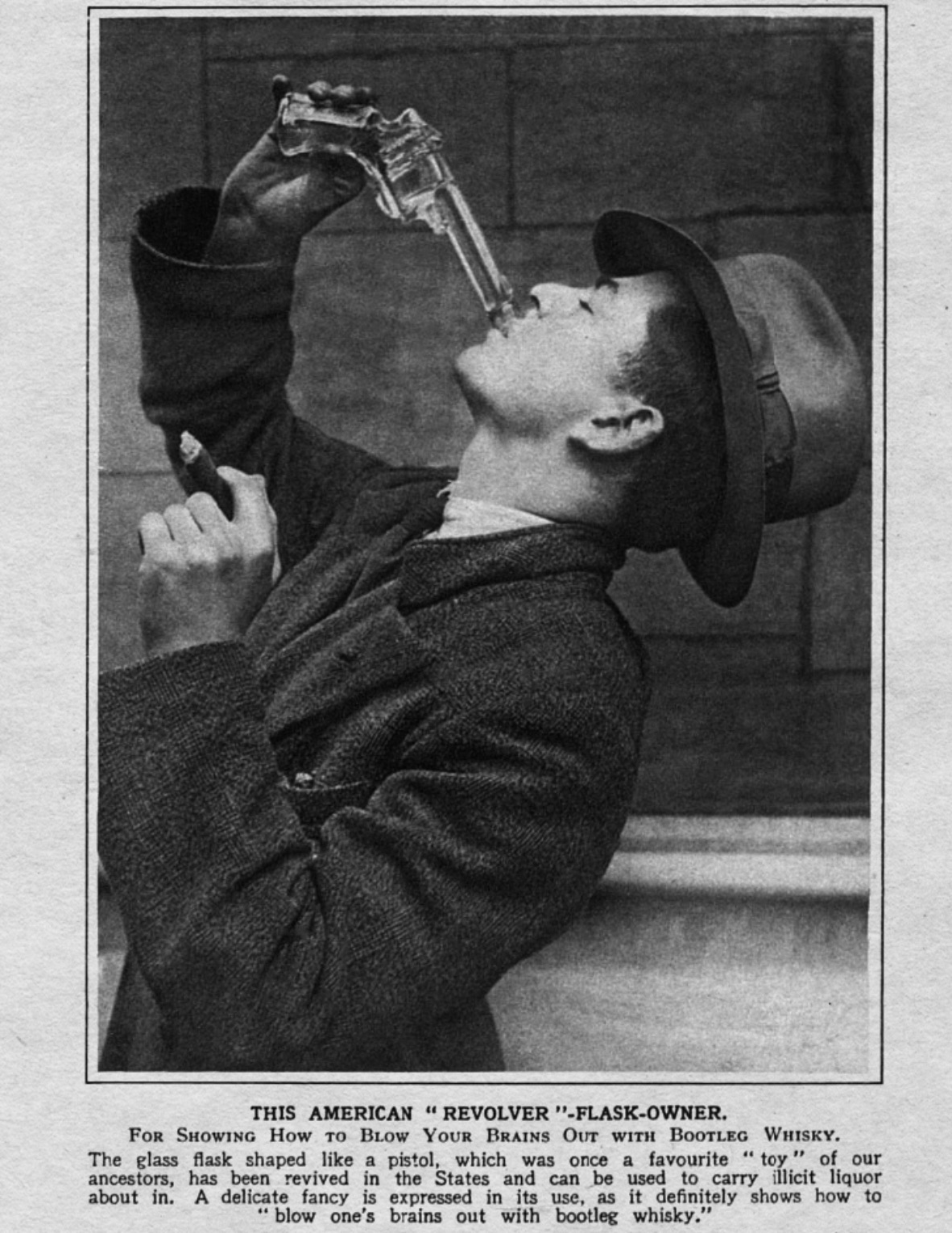 photograph - This American "Revolver"FlaskOwner. For Showing How To BLow Your Brains Out With Bootleg Whisky. The glass flask shaped a pistol, which was once a favourite "toy" of our ancestors, has been revived in the States and can be used to carry, lici