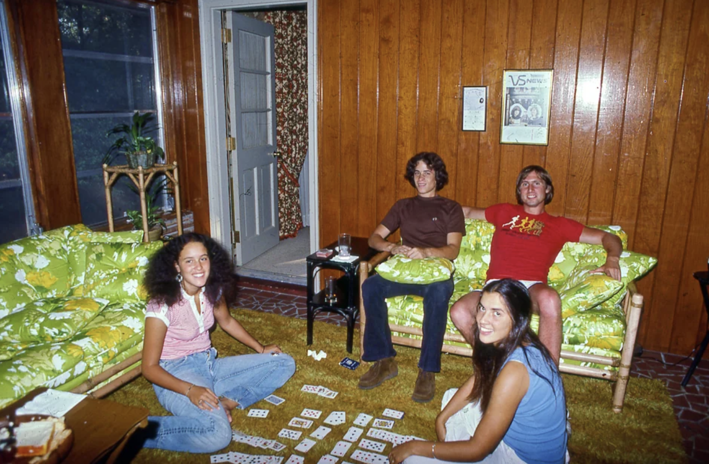 Teen party, 1978. The guys hit the couch while the girls play cards on the floor. Typical '70s living room decor. A found Kodachrome slide from the Steven Martin collection.