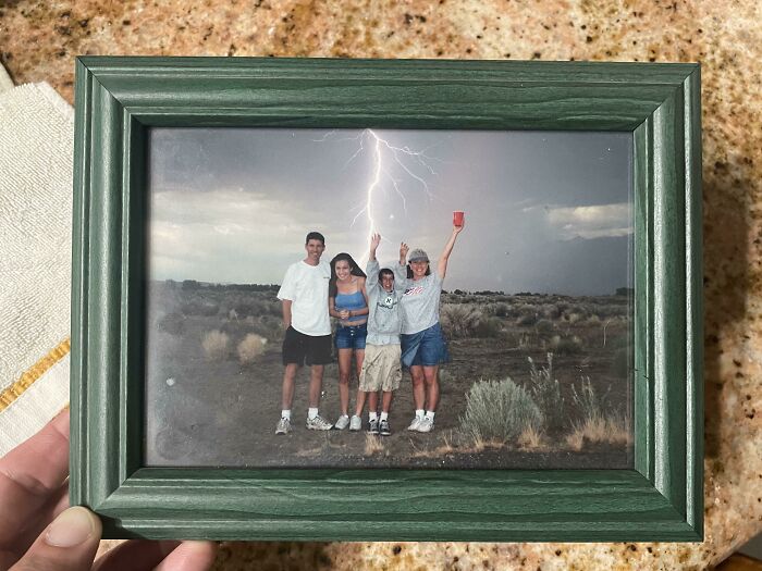 This family got the best family photo of all time with a disposable camera during a storm in Bishop, California on the 4th of july.