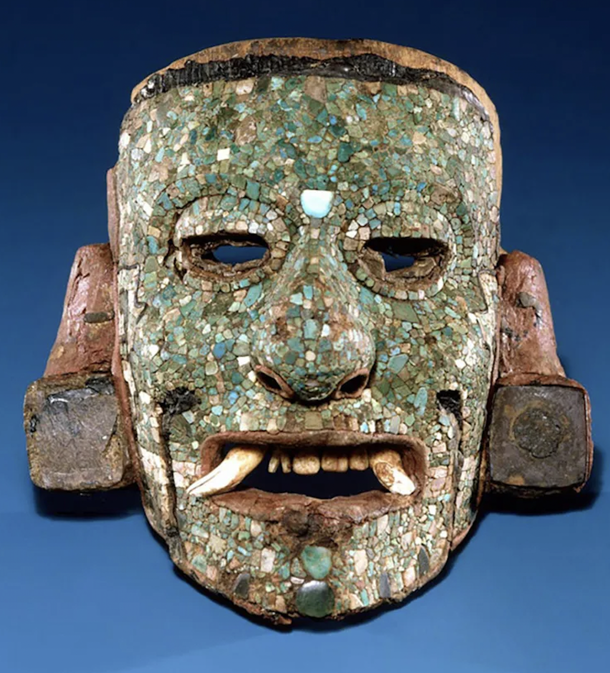 A Maya mosaic mask, made of wood and stones. 1200-1520 CE.