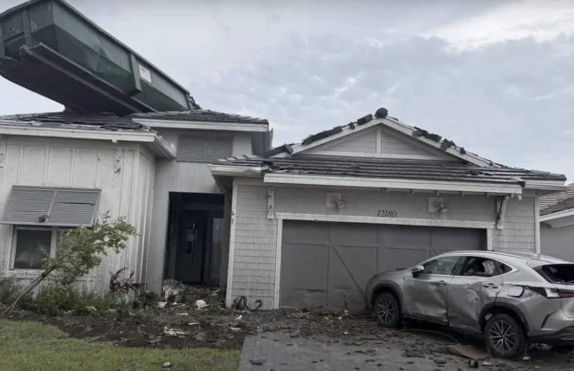 dumpster on top of house