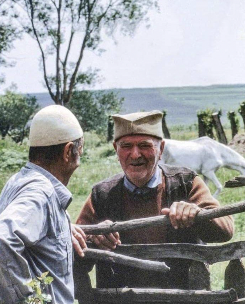 Two neighbors, an Albanian and a Serb, near Kosovo Polje, 1981.