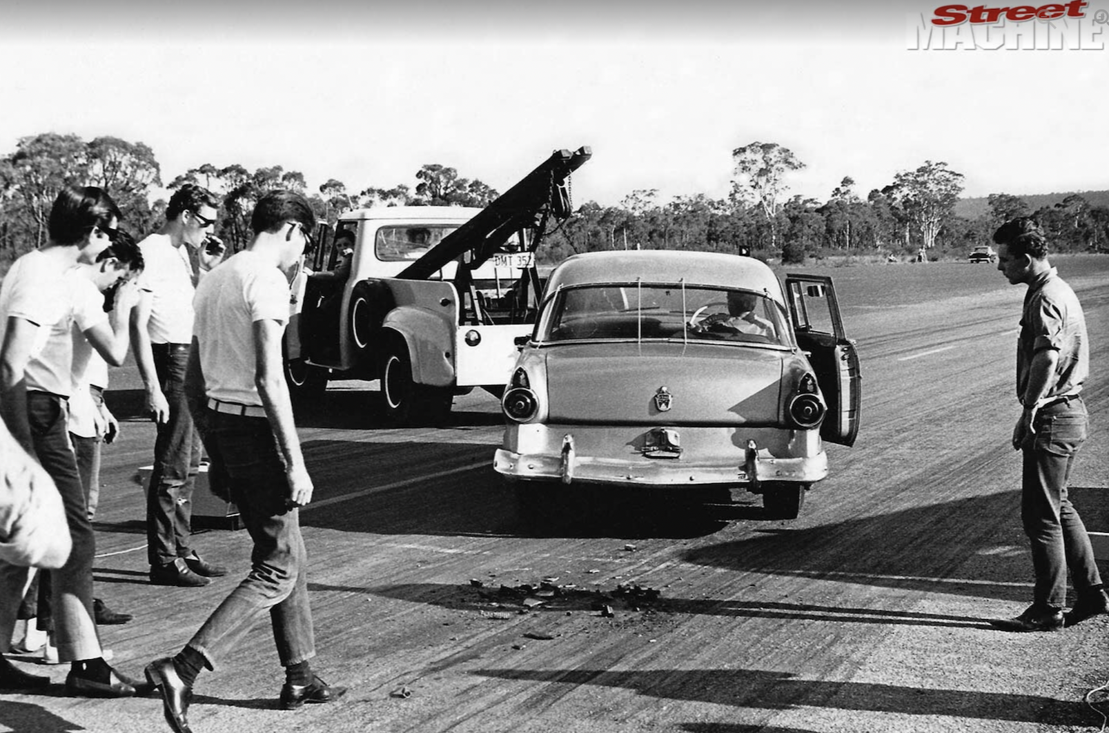 Racer Jim Cusso is towed after a transmission explosion, 1965. 