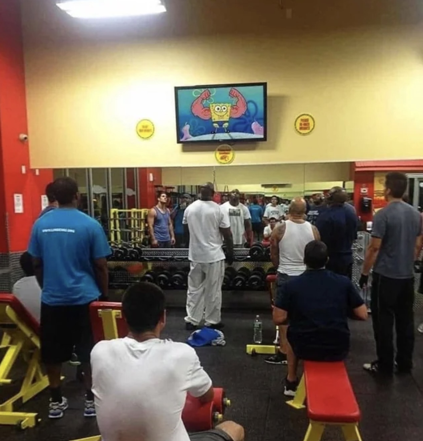 guys in gym watching tv - 30