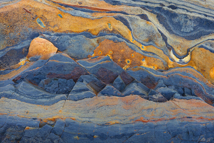 The gorgeous colors of this Sandstone cliff look like a landscape in itself.