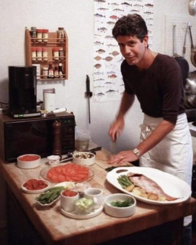 Anthony Bourdain preparing a meal in his NYC apartment, 1986.