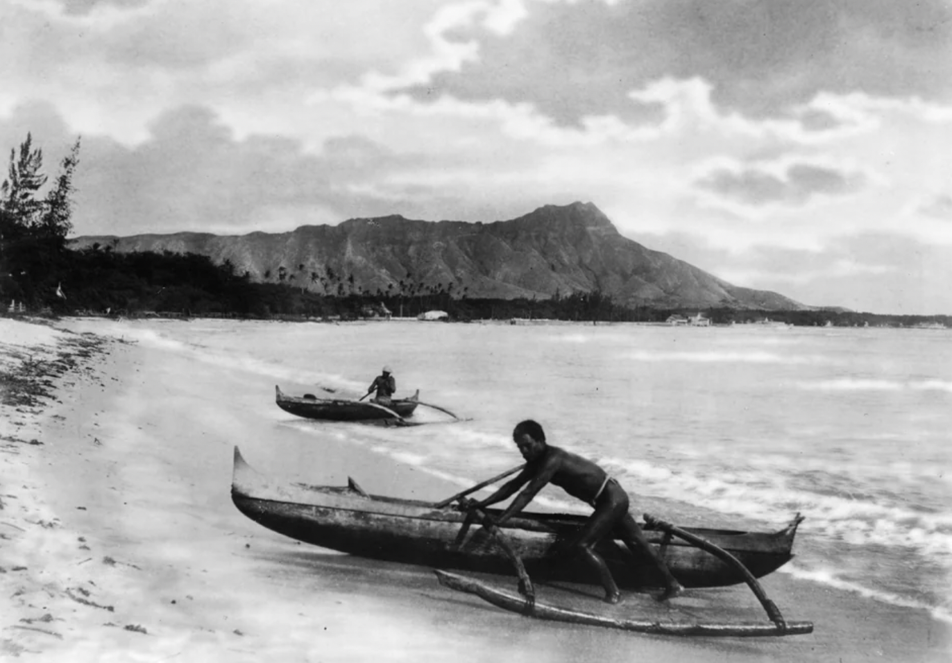 Natives of Hawaii on the beach of Waikiki after a morning of fishing in 1895.