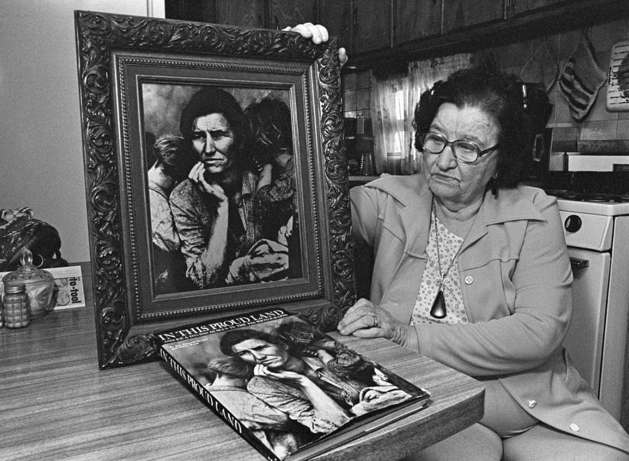 Florence Thompson, the Migrant Mother in Dorothea Lange's famous 1936 photo, holds up her likeness during an interview after her identity was discovered, October 10, 1978.