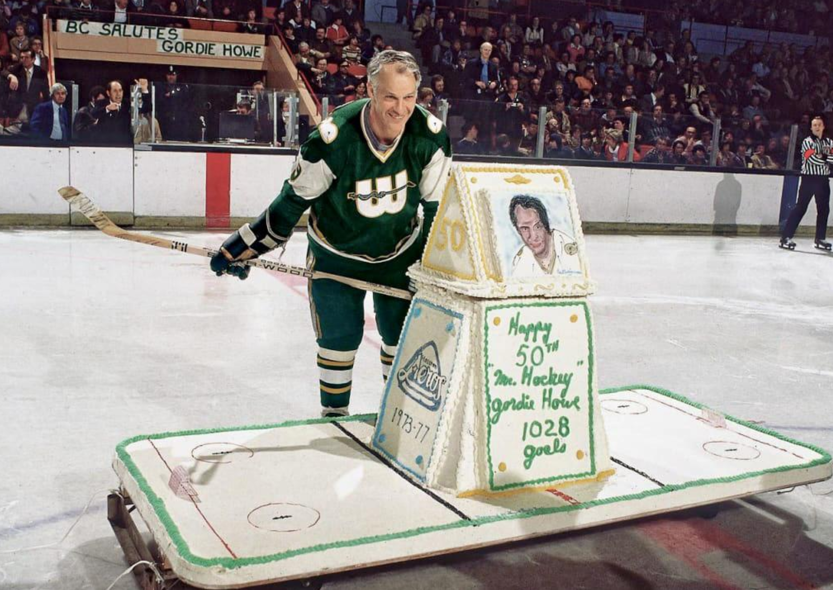 Gordie Howe, “Mr. Hockey,” admiring his 50th birthday cake before a New England Whalers game in 1978.