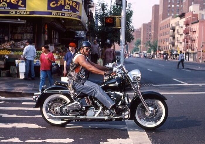 A biker cruises through the East Village (1995).