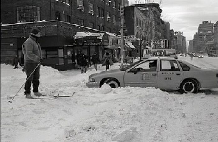 A man travels the East Village by Skis during the winter of 1996.