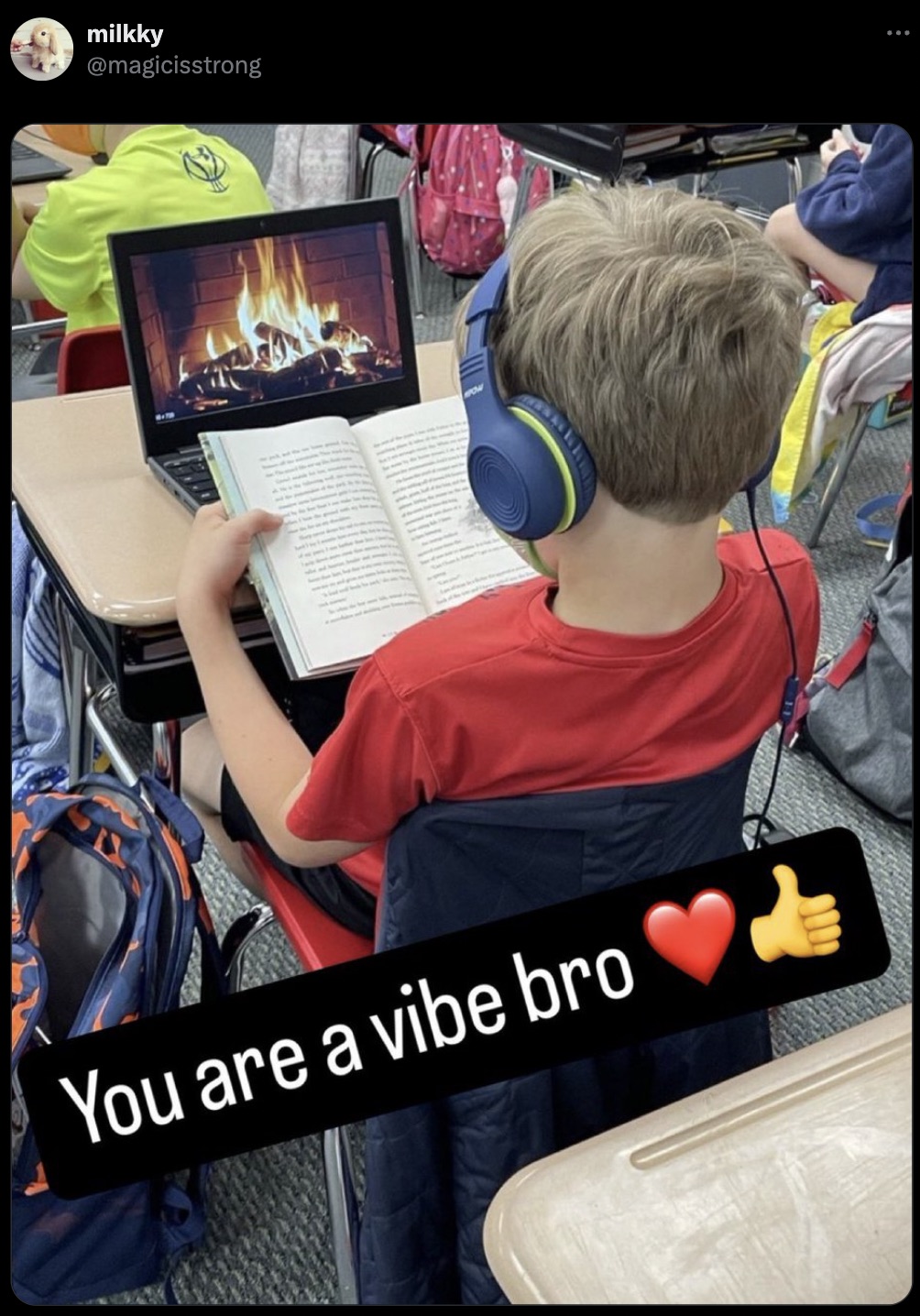 kid reading with fireplace on computer - milkky You are a vibe bro