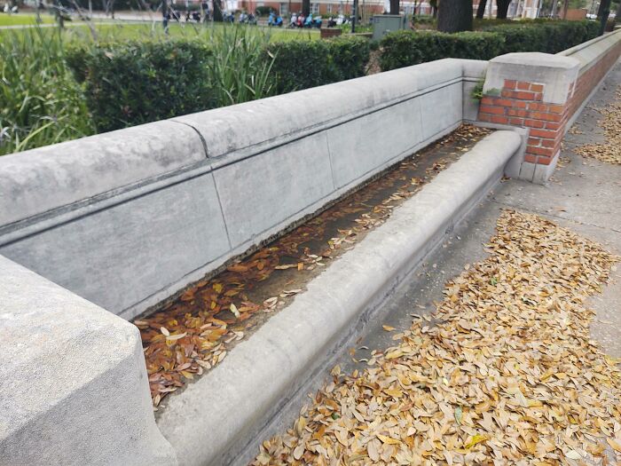 The angle of this bench causes water to pool up in it.