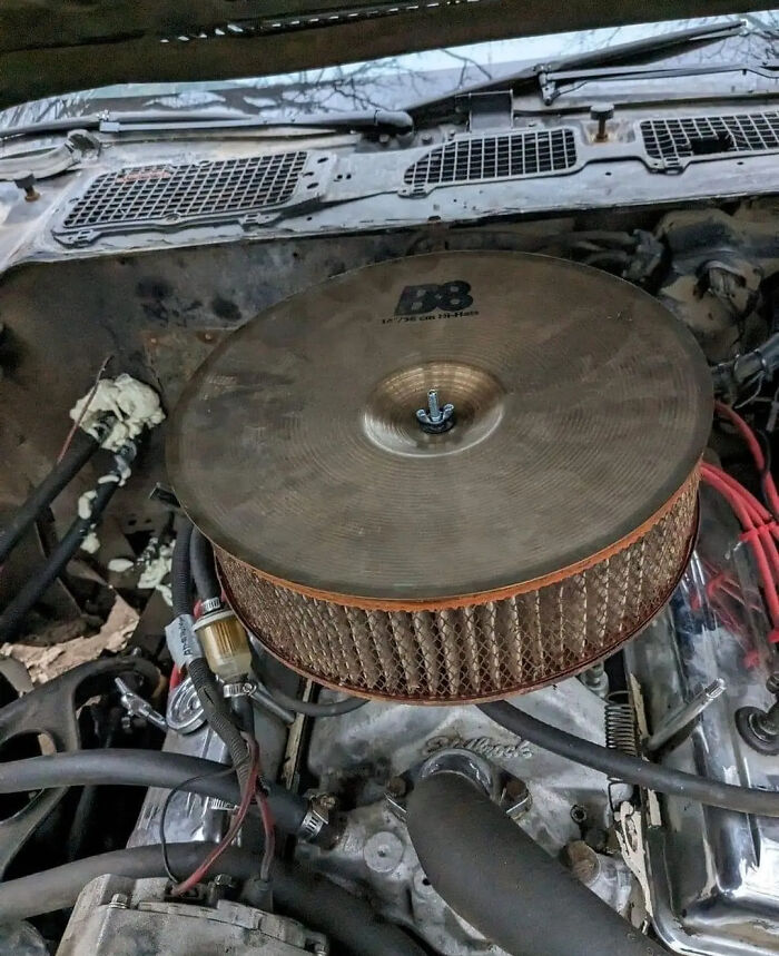 A cymbal as a carburetor cover. 