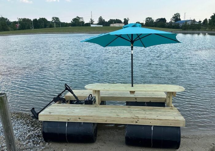 Who needs a boat when you've got a raft with a picnic table and umbrella on it?