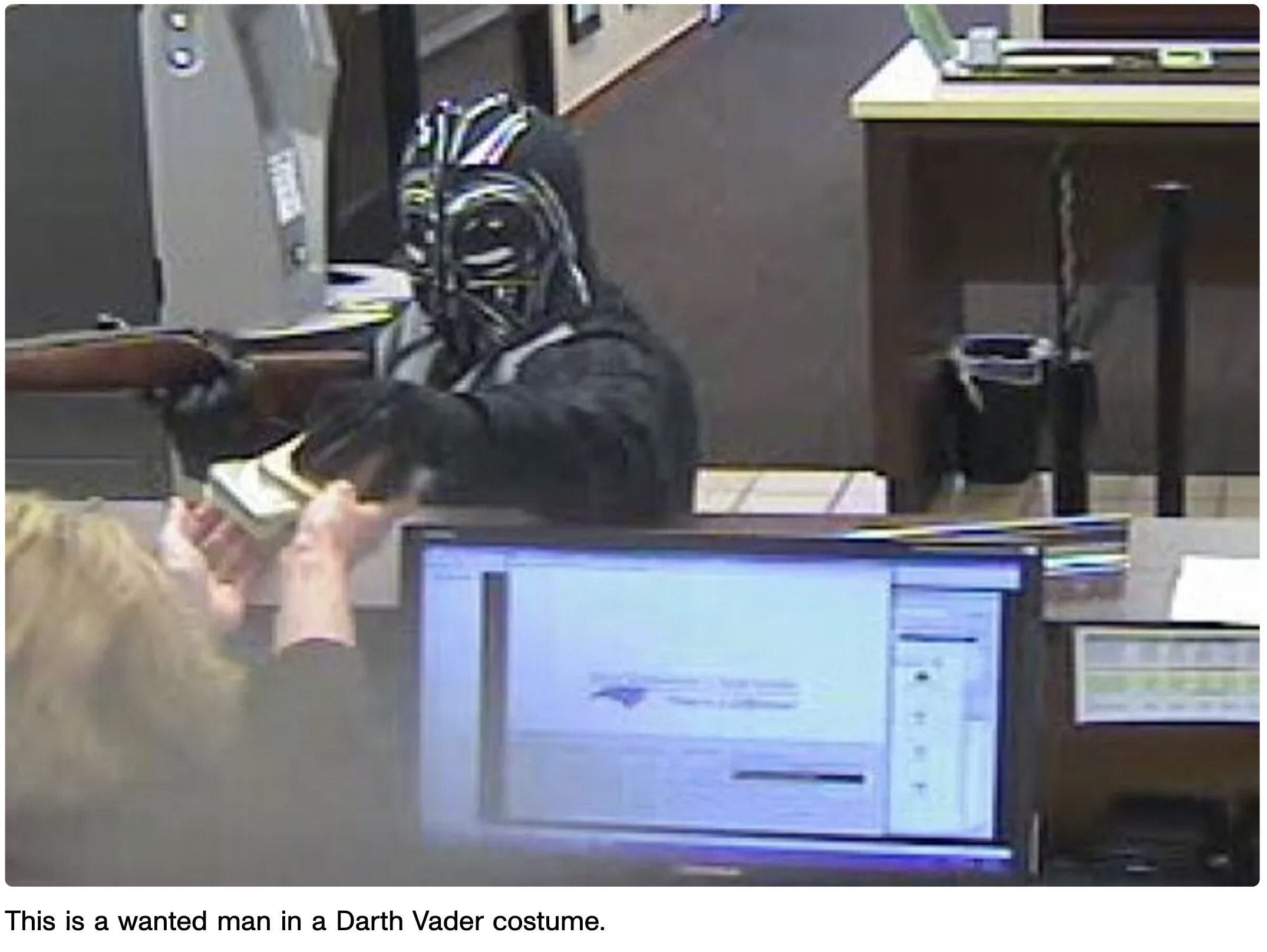 darth vader bank robbery - This is a wanted man in a Darth Vader costume.