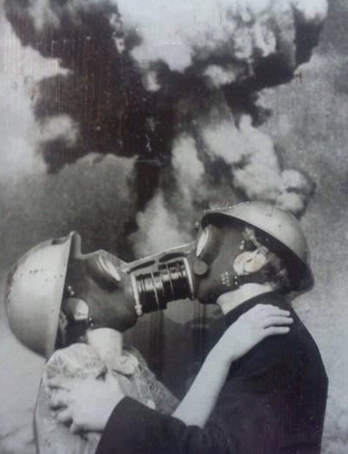 couple kissing with gas mask