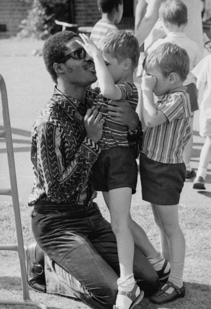 Stevie Wonder visiting a children’s school for the blind in London, 1970.