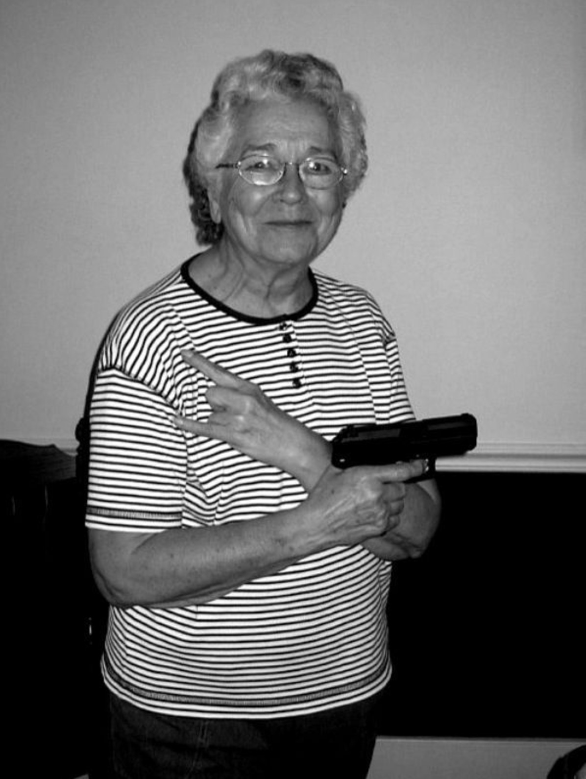 grandma holding gun