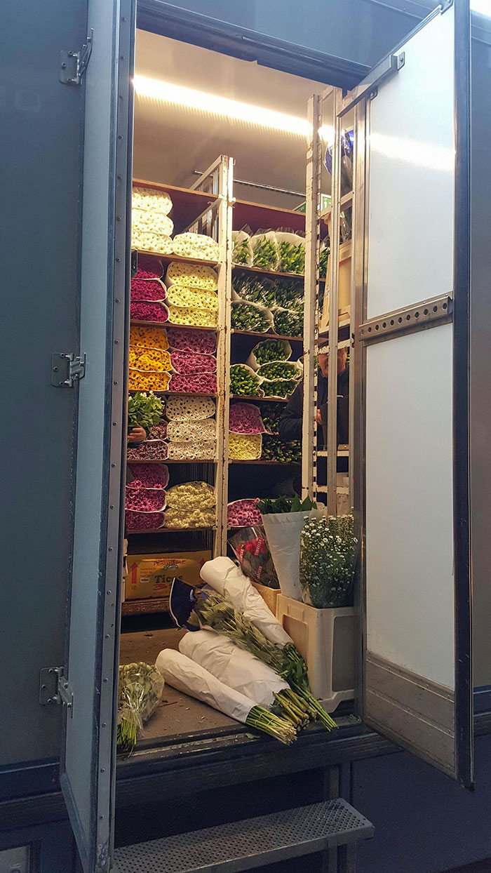 The inside of a flower delivery truck.