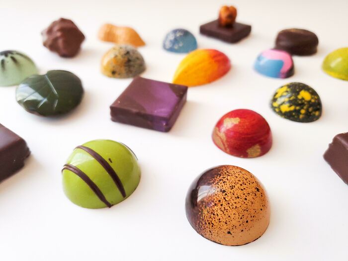 A collection of homemade bonbons that look like they belong in a rock collection.