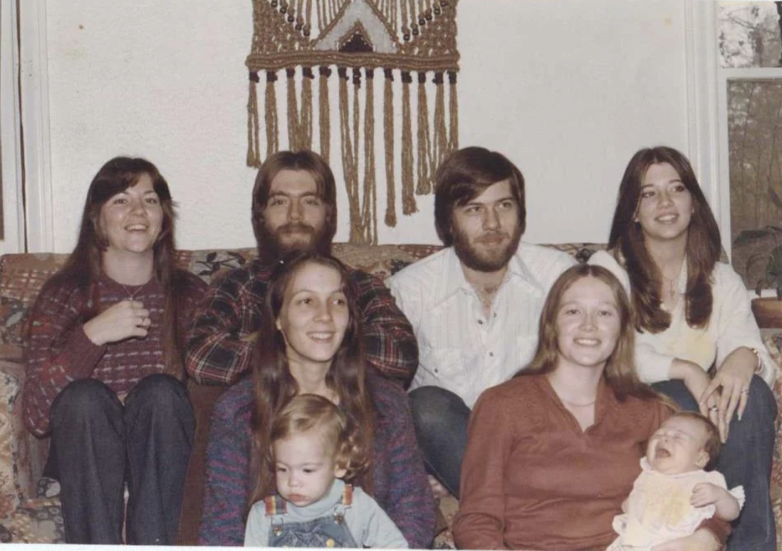 “Christmas 1980. I am the kid with the rainbow overalls and my parents are behind me.”