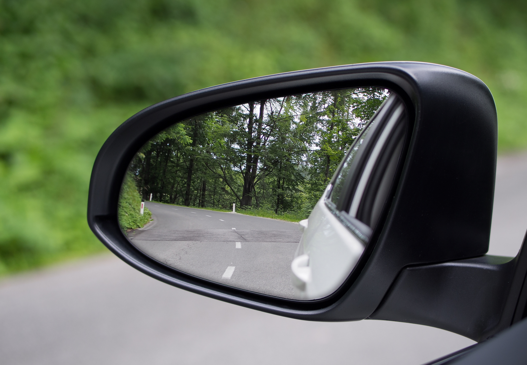 Believe it or not, you shouldn't see the side of your car in your side mirrors. This just limits field of view you could be using to see more of your surroundings. 