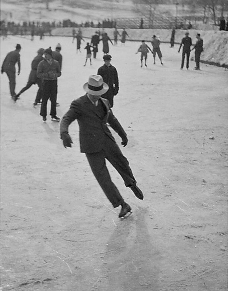 dude ice skating in a suit 1937