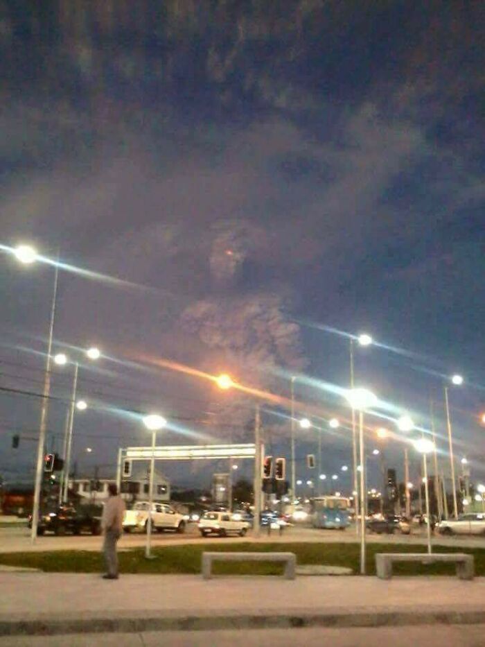 A giant emerges from the plume of volcanic ash as Volcano erupts in Chile.