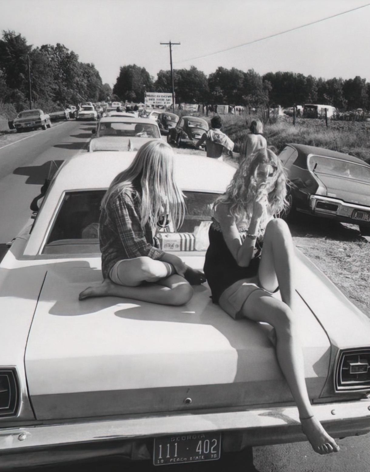 24 1970s Pics Of Chicks & Dudes On The Hoods Of Cars