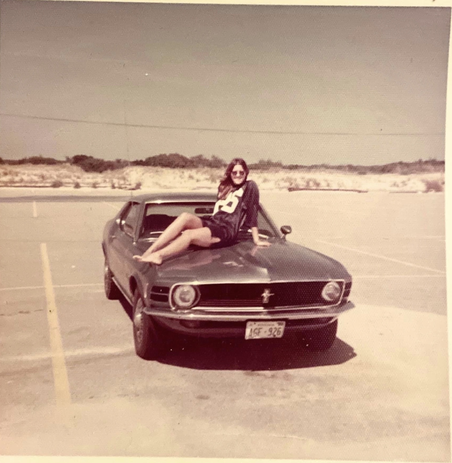 24 1970s Pics Of Chicks & Dudes On The Hoods Of Cars