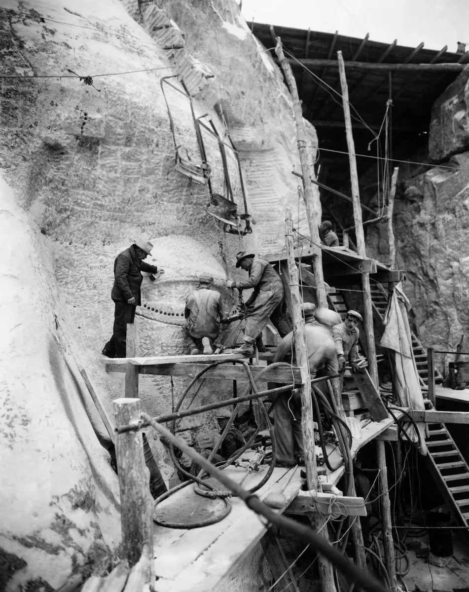 Borglum inspecting the work on Jefferson's eye.
