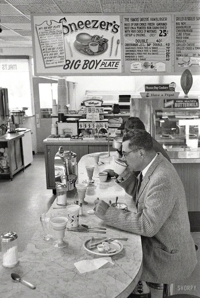 Vince Lombardi Eating at a Lunch Counter - 1960s