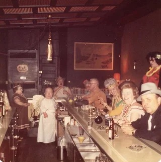 Little people behind the bar on Halloween - Chicago IL, 1969