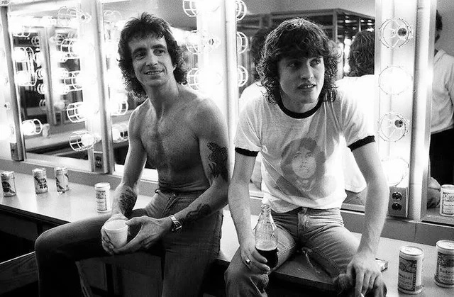 Bon Scott and Angus Young backstage - 1978