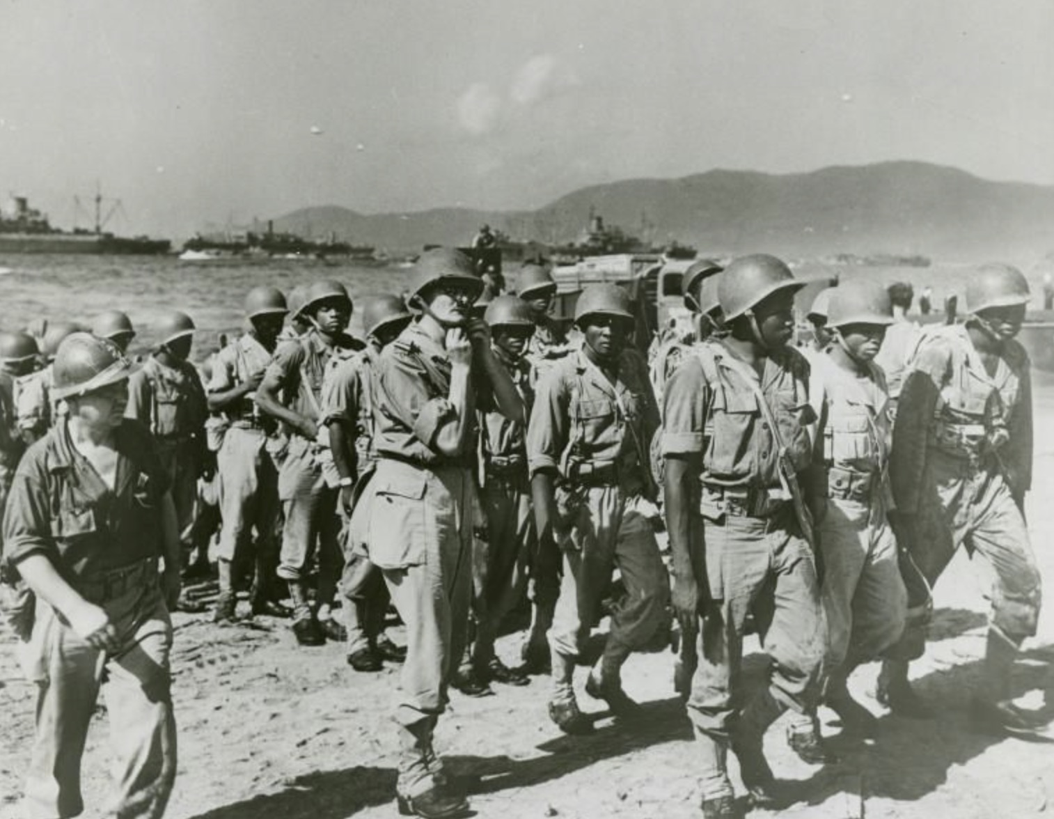 Allied troops walking onto the beach during Operation Dragoon