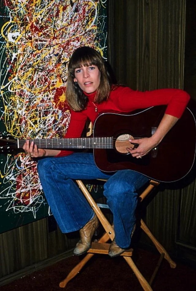 Jamie Lee Curtis strumming in 1978