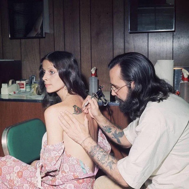 A woman getting a tattoo in 1973.