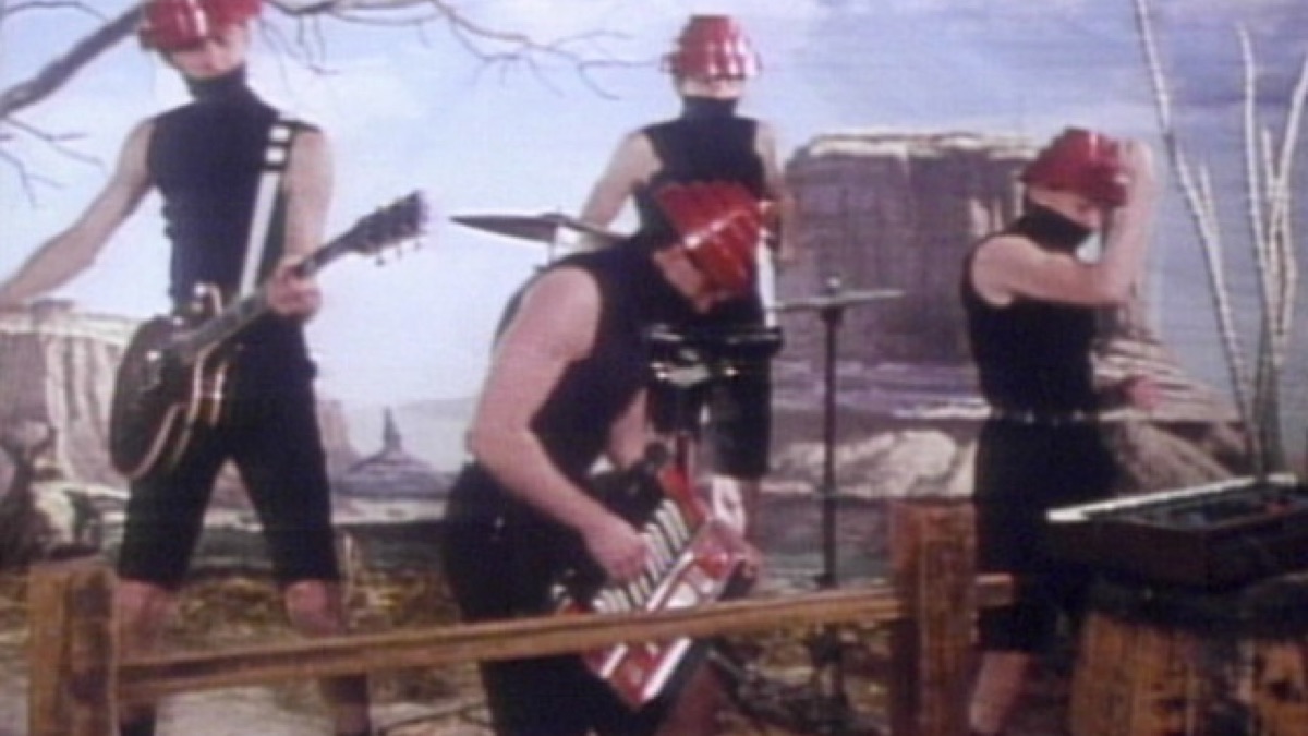 A still from the “Whip It” music video in 1980.