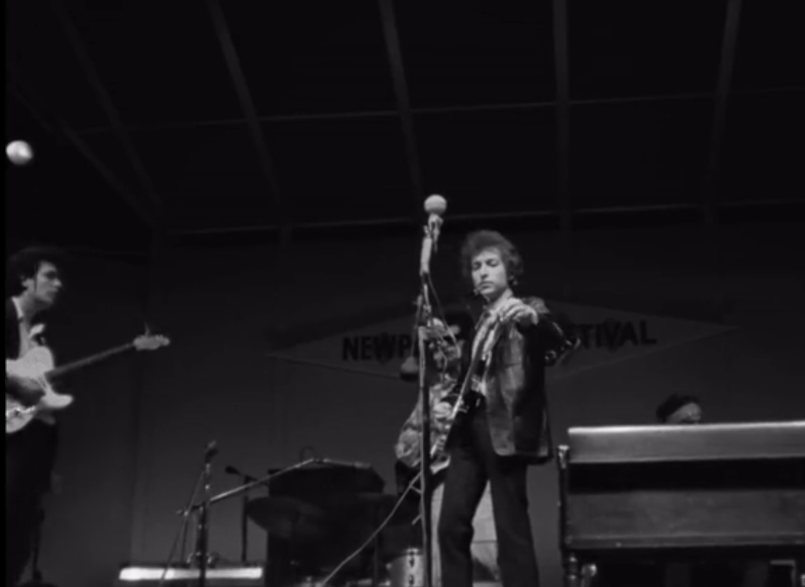 Bob Dylan going electric at Newport Folk Festival, 1965.