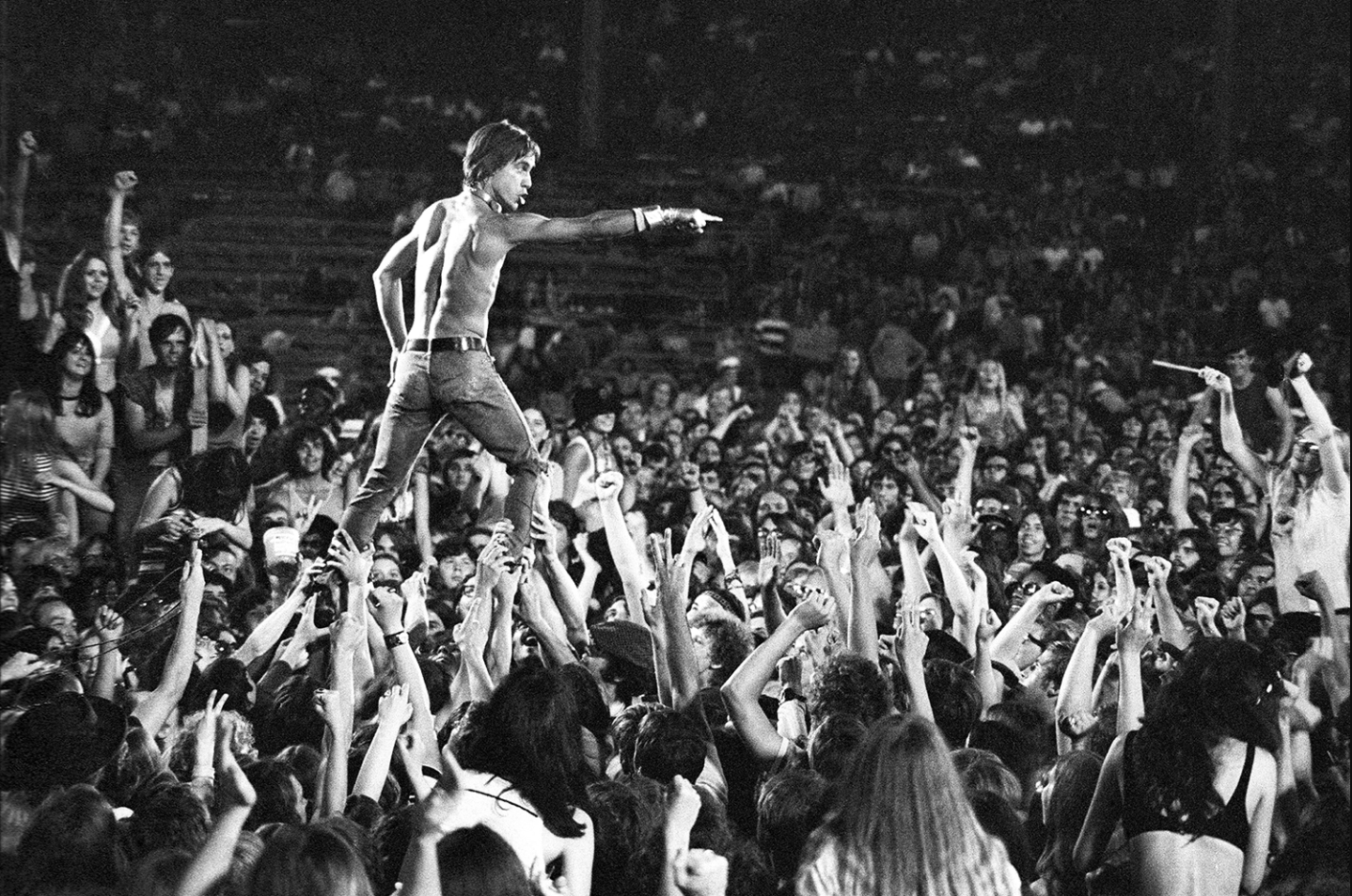 Iggy Pop leaping into the crowd in the 70s.